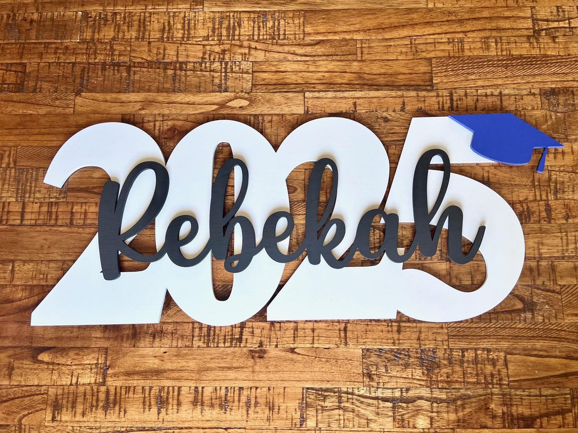 Wood graduation sign with cap and year