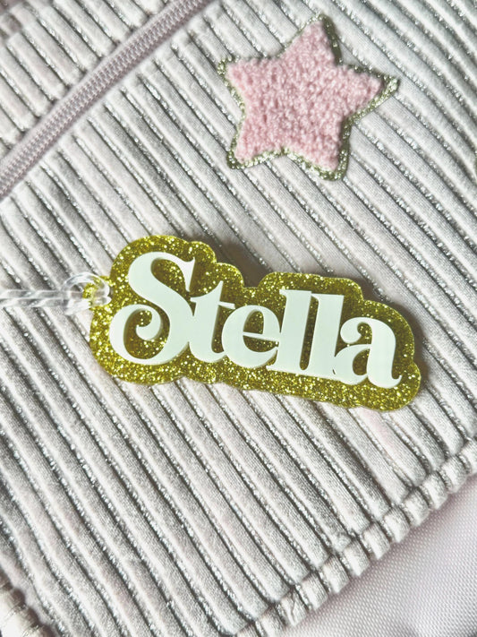 Custom Name Acrylic Bag Tag – White Name on Gold Glitter Background, 1–1.5” Tall x 5” Wide, Personalized Backpack Tag, Dance & Sports Bag Ac
