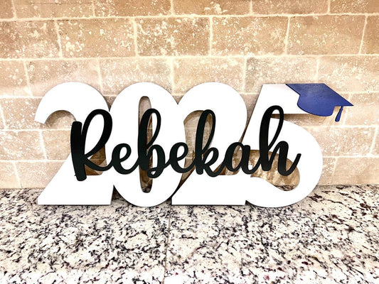 Wood graduation sign with cap and year