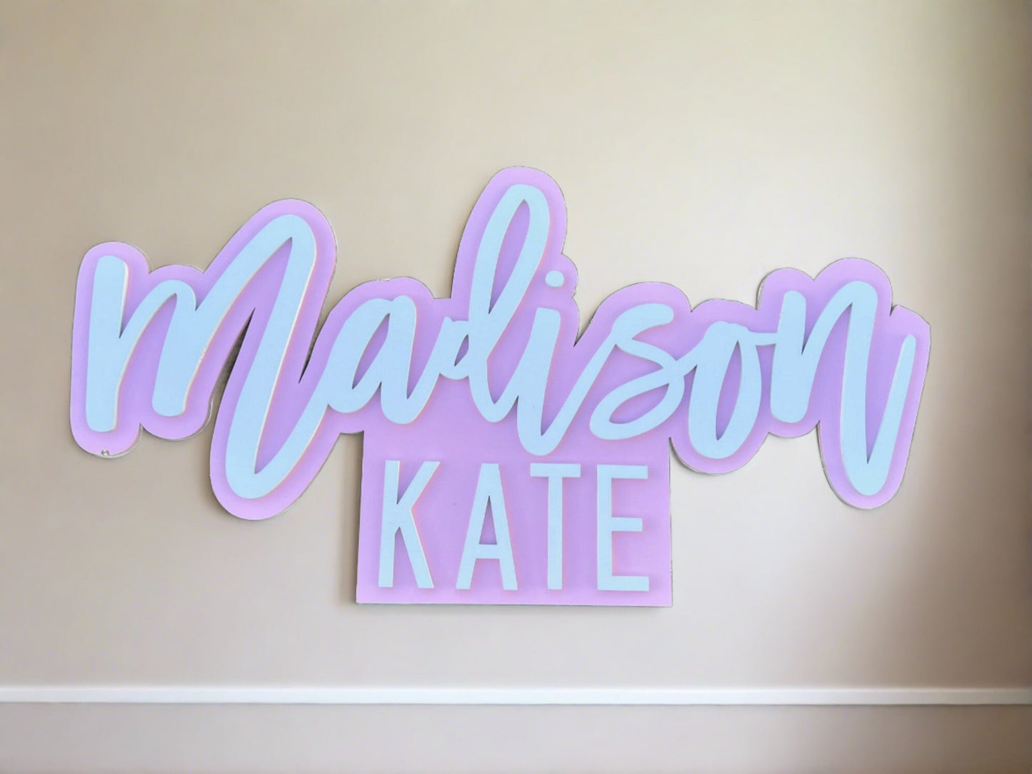 First and middle name outline sign on pink background